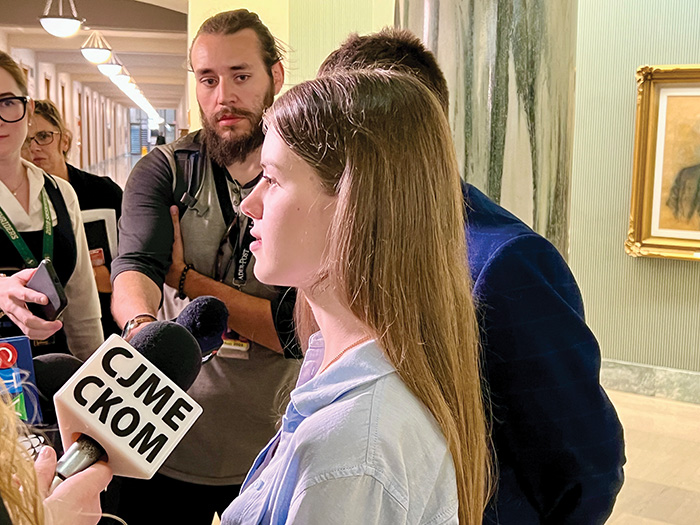 Knyhnytska answering reporters questions on the impact the change will have on her.